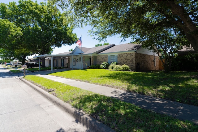 6304 Kary Lynn Dr S, Watauga, TX 76148 - ranch-style house featuring brick siding, a front yard, and a carport