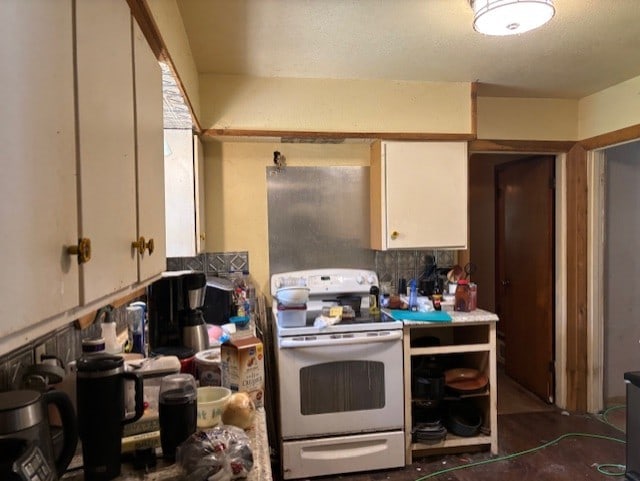 4132 Fm 546, Princeton, TX 75407 - kitchen featuring electric range, white cabinets, and light countertops