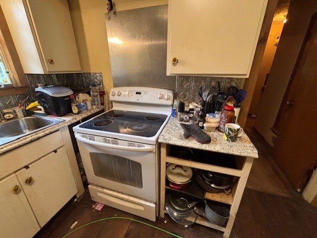 4132 Fm 546, Princeton, TX 75407 - kitchen with white range with electric cooktop, light countertops, a sink, and decorative backsplash