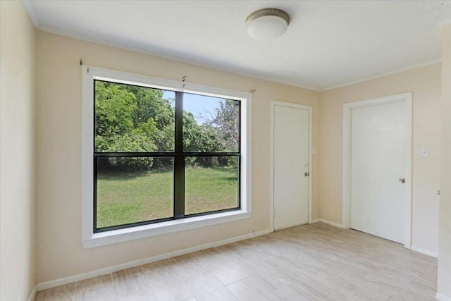 104 Mackinnon, Mount Pleasant, TX 75455 - empty room featuring crown molding and baseboards