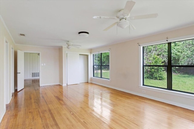 104 Mackinnon, Mount Pleasant, TX 75455 - empty room featuring a ceiling fan, light wood-style floors, baseboards, and ornamental molding