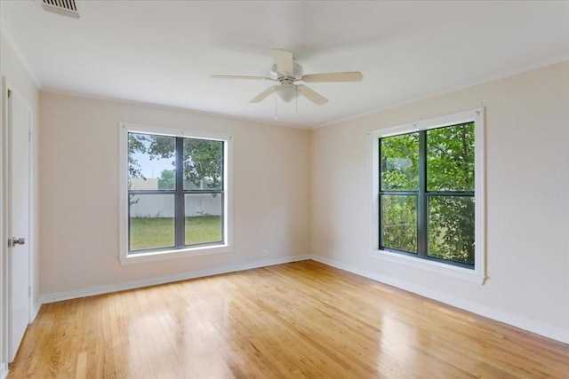 104 Mackinnon, Mount Pleasant, TX 75455 - empty room featuring wood finished floors, crown molding, baseboards, and ceiling fan