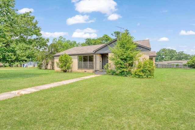 104 Mackinnon, Mount Pleasant, TX 75455 - view of front of house featuring a front lawn and brick siding