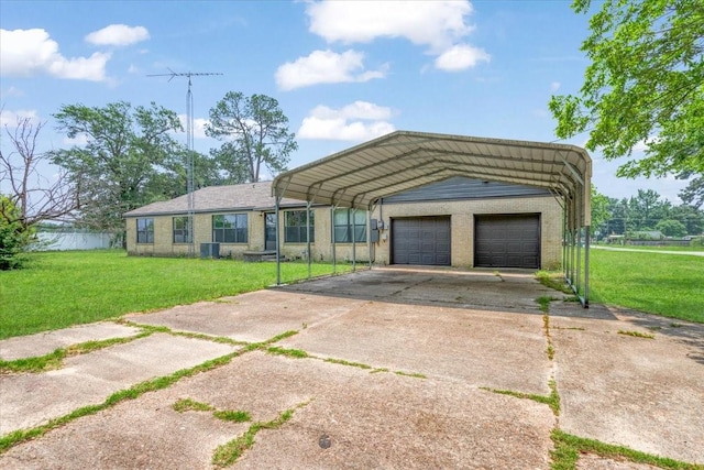 104 Mackinnon, Mount Pleasant, TX 75455 - view of front facade featuring a front yard, a garage, driveway, and brick siding