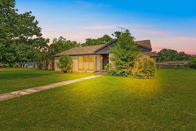 104 Mackinnon, Mount Pleasant, TX 75455 - view of front of home featuring a front yard and brick siding