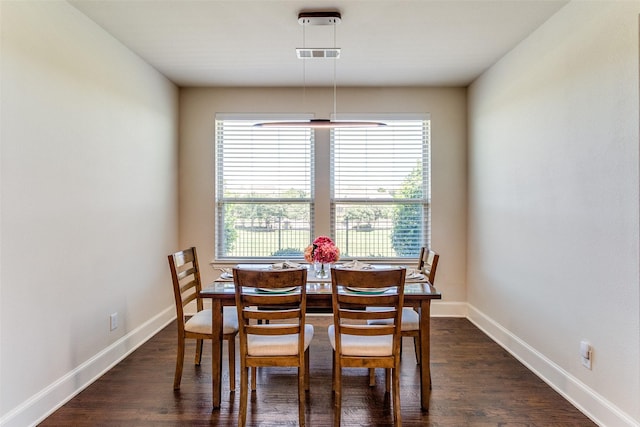131 Lavaca Dr, Irving, TX 75039 - dining room featuring dark wood-style floors and baseboards