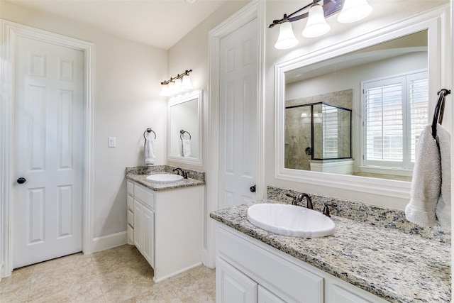 131 Lavaca Dr, Irving, TX 75039 - full bathroom featuring a stall shower, two vanities, and tile patterned flooring