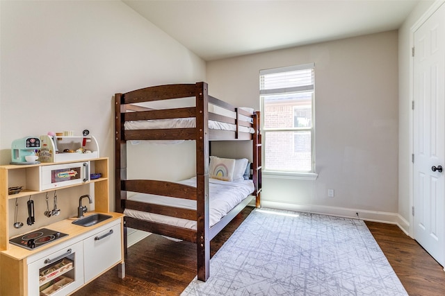 131 Lavaca Dr, Irving, TX 75039 - bedroom with dark wood finished floors, a sink, and baseboards