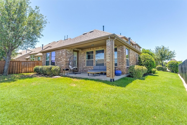 131 Lavaca Dr, Irving, TX 75039 - rear view of property with a patio area, brick siding, and roof with shingles