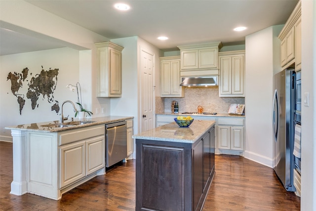131 Lavaca Dr, Irving, TX 75039 - kitchen with a sink, cream cabinets, a peninsula, light stone counters, and recessed lighting