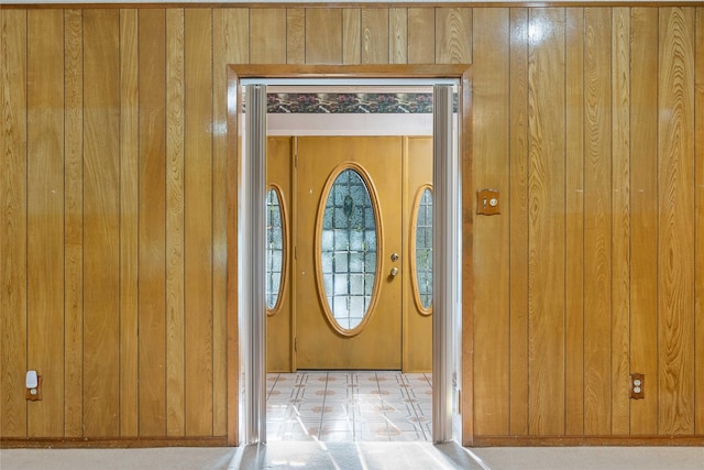 1025 S Lamar St, De Leon, TX 76444 - foyer with wooden walls and tile patterned floors