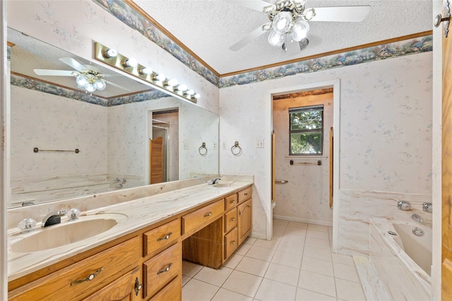 1025 S Lamar St, De Leon, TX 76444 - full bath with ceiling fan, a textured ceiling, a garden tub, tile patterned floors, and double vanity