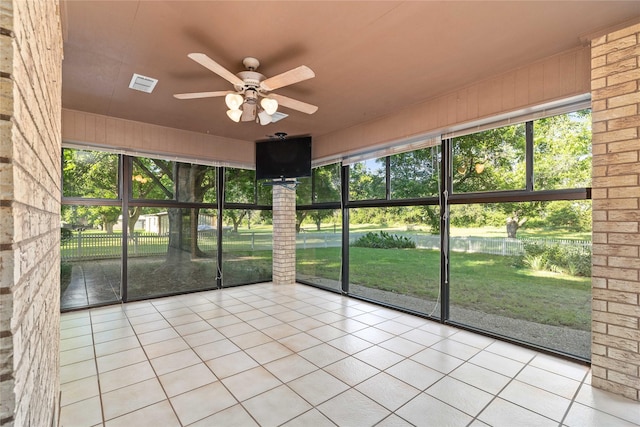 1025 S Lamar St, De Leon, TX 76444 - unfurnished sunroom featuring a ceiling fan and plenty of natural light