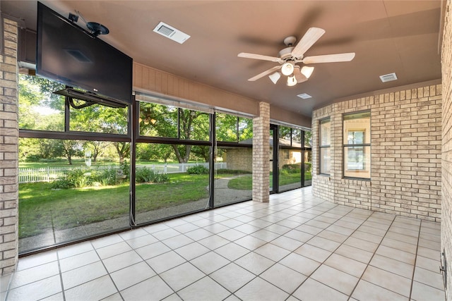 1025 S Lamar St, De Leon, TX 76444 - unfurnished sunroom with a ceiling fan and plenty of natural light