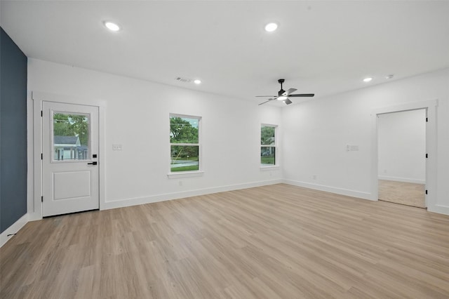 2738 W Washington St, Denison, TX 75020 - unfurnished living room featuring light wood-type flooring, recessed lighting, ceiling fan, and baseboards