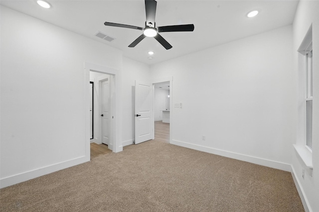 2738 W Washington St, Denison, TX 75020 - unfurnished bedroom with light carpet, recessed lighting, baseboards, and ceiling fan