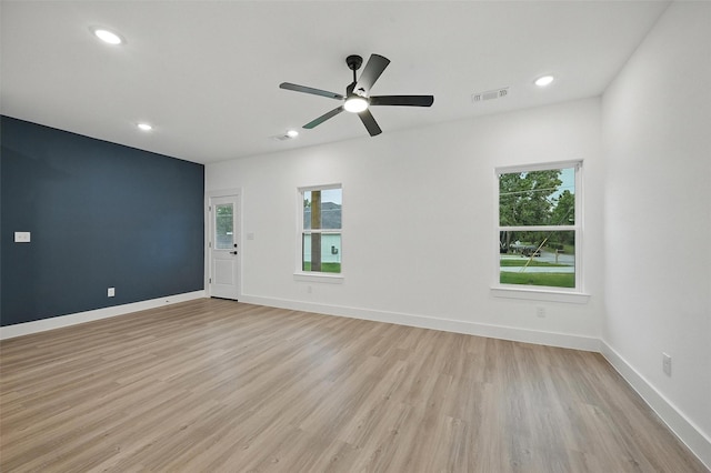 2738 W Washington St, Denison, TX 75020 - empty room with light wood-style floors, recessed lighting, ceiling fan, and baseboards