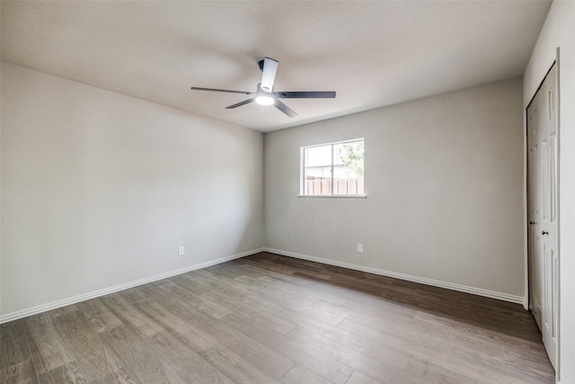 1336 Whittenburg Dr, Fort Worth, TX 76134 - unfurnished bedroom with wood finished floors, baseboards, a closet, and ceiling fan