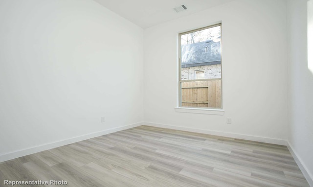 8409 Peach St, Justin, TX 76247 - spare room featuring light wood-type flooring and baseboards