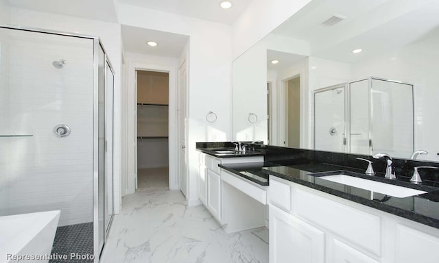 8409 Peach St, Justin, TX 76247 - bathroom with a stall shower, double vanity, marble finish flooring, a freestanding bath, and recessed lighting