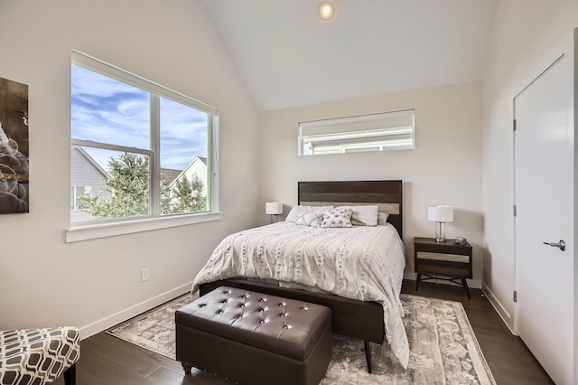 1115 Crownview Ln, Dallas, TX 75208 - bedroom with vaulted ceiling, baseboards, and wood finished floors