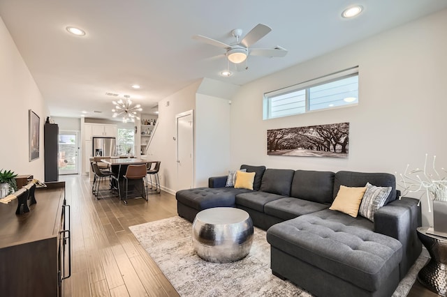 1115 Crownview Ln, Dallas, TX 75208 - living room featuring plenty of natural light, a ceiling fan, recessed lighting, light wood-style flooring, and a chandelier