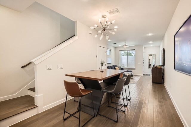 1115 Crownview Ln, Dallas, TX 75208 - dining area with dark wood-style floors, a chandelier, stairway, baseboards, and recessed lighting