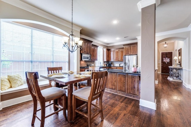 5946 Wallis Dr, Frisco, TX 75033 - dining room with a chandelier, dark wood finished floors, arched walkways, ornate columns, and baseboards