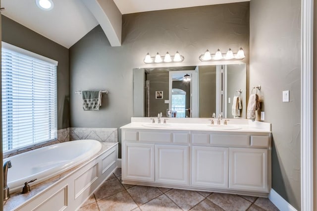 5946 Wallis Dr, Frisco, TX 75033 - full bathroom with a bath, double vanity, tile patterned flooring, ceiling fan, and lofted ceiling