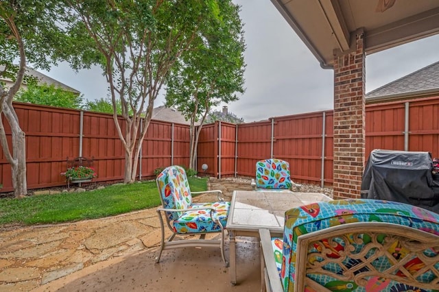 5946 Wallis Dr, Frisco, TX 75033 - fenced backyard with a patio, area for grilling, and outdoor dining space