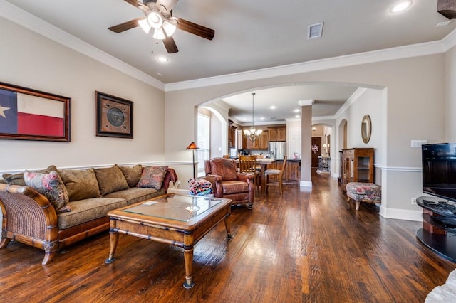 5946 Wallis Dr, Frisco, TX 75033 - living area with arched walkways, dark wood-style flooring, a ceiling fan, crown molding, and recessed lighting