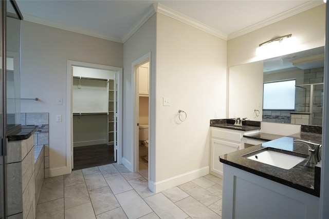720 Madeline Ct, Azle, TX 76020 - bathroom featuring two vanities, crown molding, toilet, a spacious closet, and marble finish flooring