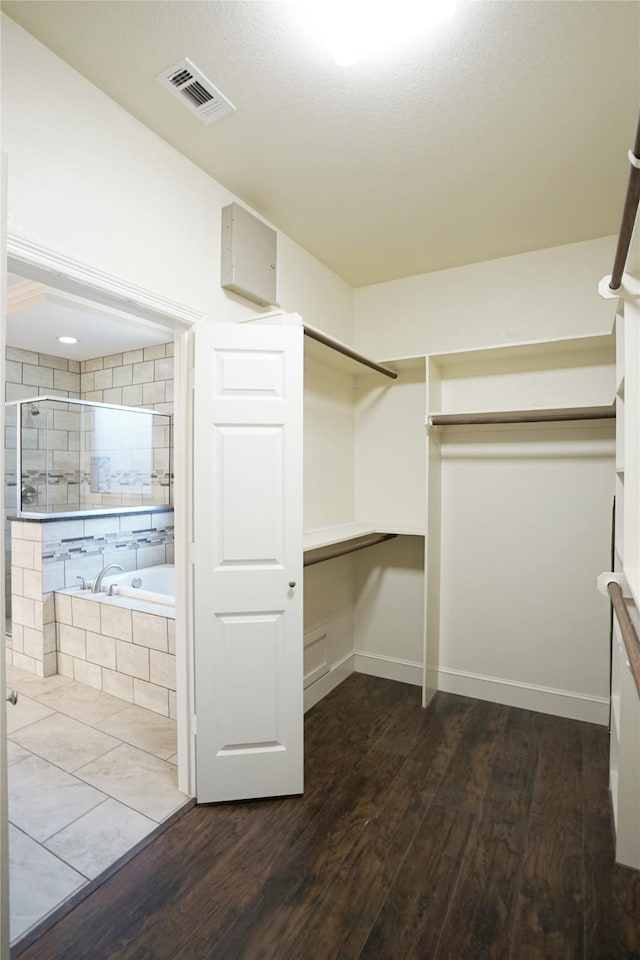 720 Madeline Ct, Azle, TX 76020 - spacious closet featuring wood finished floors