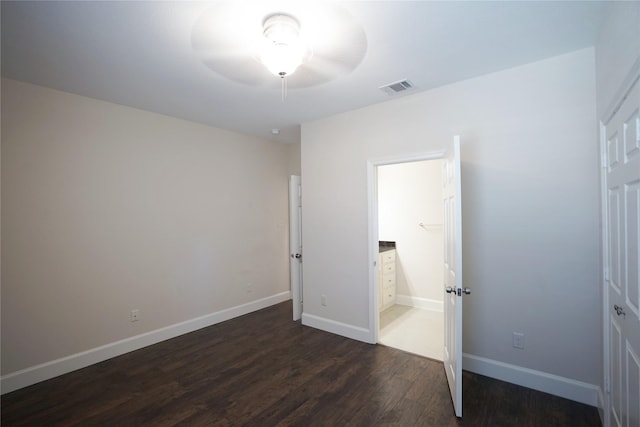 720 Madeline Ct, Azle, TX 76020 - unfurnished bedroom featuring dark wood-style flooring, baseboards, and ensuite bath