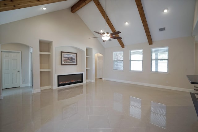 720 Madeline Ct, Azle, TX 76020 - unfurnished living room featuring arched walkways, built in features, baseboards, recessed lighting, and beam ceiling