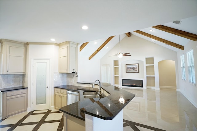 720 Madeline Ct, Azle, TX 76020 - kitchen with arched walkways, a peninsula, backsplash, built in shelves, and a sink