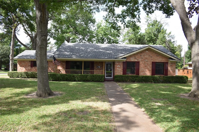 500 Riggs Cir, Mesquite, TX 75149 - ranch-style home with brick siding, roof with shingles, a front lawn, and covered porch