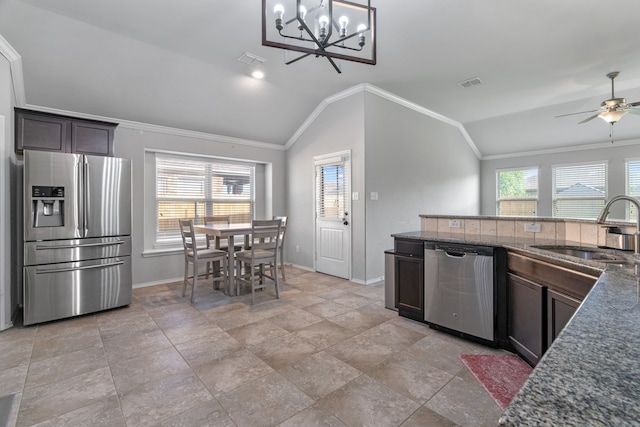 4130 Gaillardia Way, Forney, TX 75126 - kitchen featuring stainless steel appliances, a sink, vaulted ceiling, baseboards, and plenty of natural light