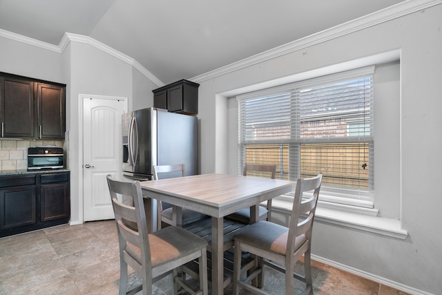 4130 Gaillardia Way, Forney, TX 75126 - dining area with crown molding, vaulted ceiling, and baseboards
