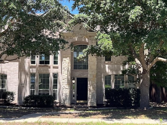 5655 Redgum Dr, Fort Worth, TX 76244 - view of property hidden behind natural elements with stone siding