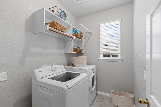 5655 Redgum Dr, Fort Worth, TX 76244 - laundry area featuring washer and dryer, light tile patterned flooring, and baseboards