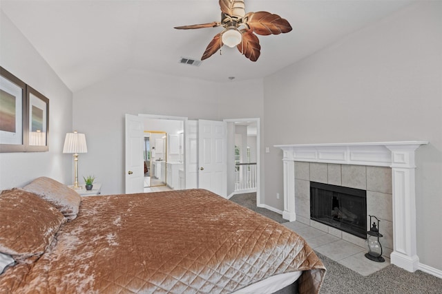 5655 Redgum Dr, Fort Worth, TX 76244 - bedroom with lofted ceiling, carpet flooring, a tiled fireplace, ceiling fan, and baseboards