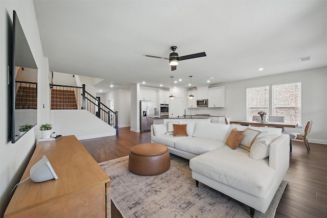 3501 Alamosa River Dr, Prosper, TX 75078 - living area with stairs, dark wood-type flooring, recessed lighting, baseboards, and ceiling fan