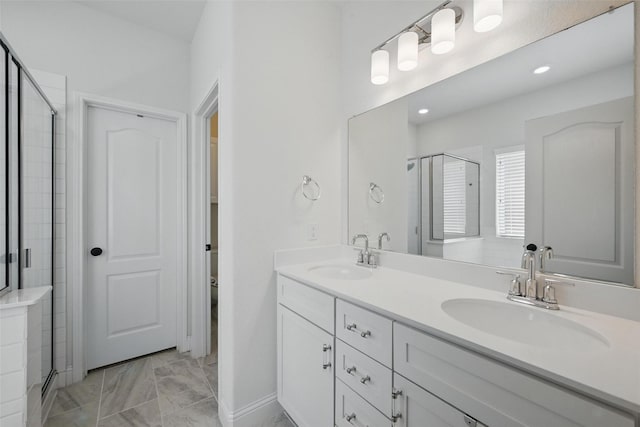 3501 Alamosa River Dr, Prosper, TX 75078 - full bath featuring a stall shower, double vanity, marble look tiles, and recessed lighting