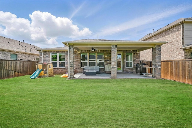 3501 Alamosa River Dr, Prosper, TX 75078 - rear view of house with a ceiling fan, a patio, outdoor lounge area, a playground, and brick siding