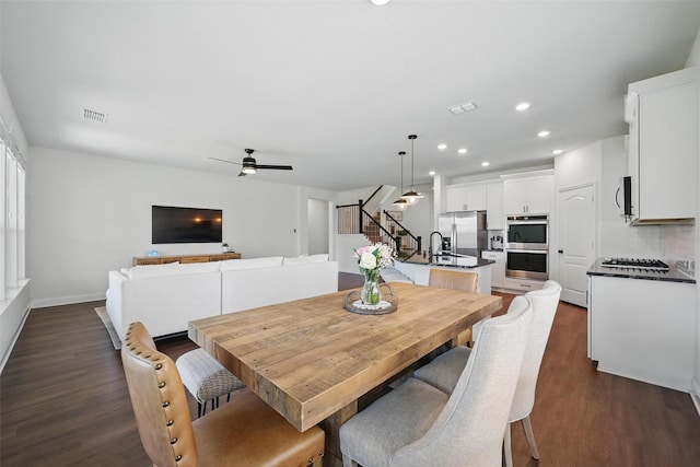 3501 Alamosa River Dr, Prosper, TX 75078 - dining space featuring stairway, dark wood-style flooring, ceiling fan, recessed lighting, and baseboards