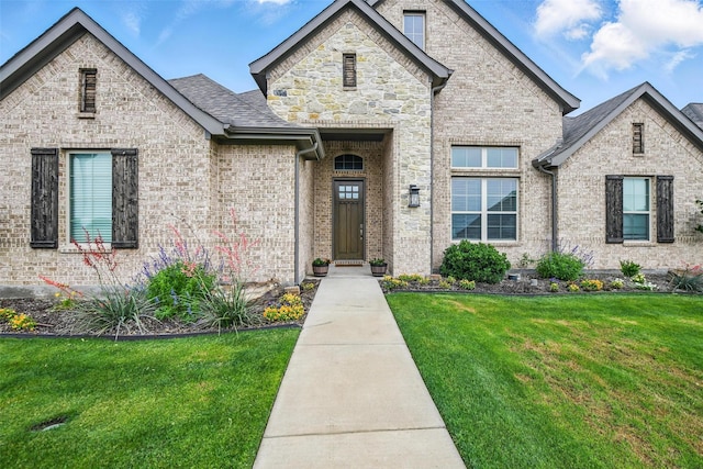 132 Parkview Ln, Boyd, TX 76023 - french country style house with a front lawn, brick siding, and roof with shingles