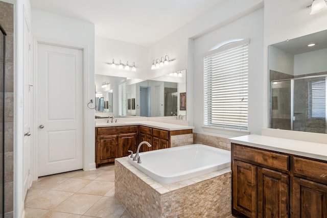 546 El Camino Dr, Frisco, TX 75036 - full bathroom with a stall shower, vanity, a garden tub, and tile patterned flooring