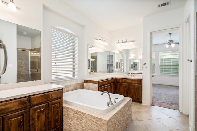 546 El Camino Dr, Frisco, TX 75036 - full bath featuring a ceiling fan, a stall shower, vanity, a bath, and tile patterned floors