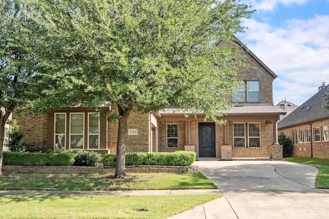 546 El Camino Dr, Frisco, TX 75036 - view of front of home featuring brick siding and driveway